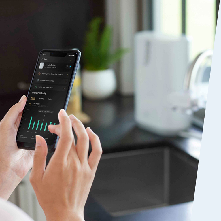 Person using the Amway Healthy Home app to monitor their eSpring Water Purifier.
