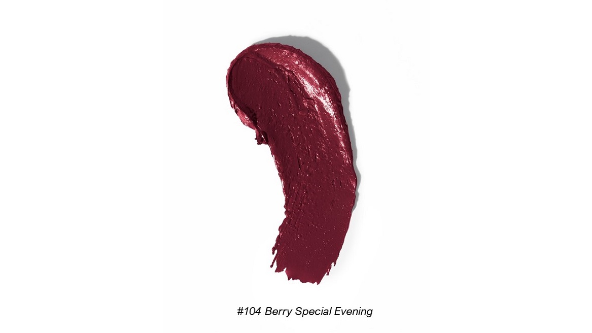 A sample of berry-red lipstick smeared against a white background.